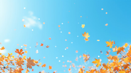 Fototapeta na wymiar Bright orange autumn leaves captured floating mid-air with a clear blue sky as the backdrop.