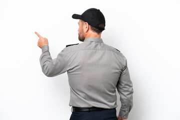 Middle age security man isolated on white background pointing back with the index finger