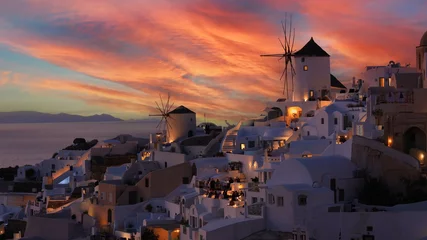 Fototapeten The famous of landscape view point as Sunset sky scene at Oia town on Santorini island, Greece © SASITHORN