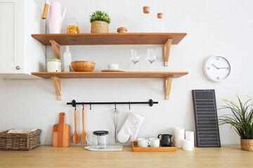 Interior of empty modern white kitchen with various objects