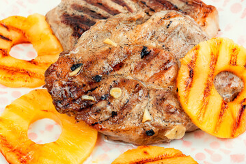 Grilled meat steak with ananas.