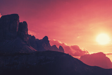 Silhouette of rocks against the sunset sky. Mountain landscape background. The dolomites in South...