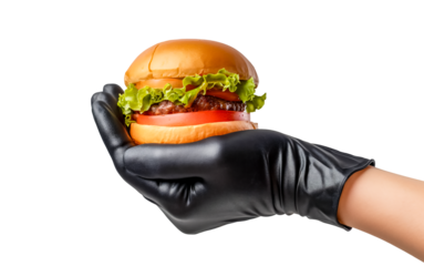 Hamburger in hand isolated on white transparent background. A hand in a black glove holds a juicy beef burger, png. fast food concept.
