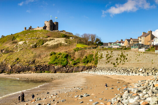 Criccieth, Wales, UK - Criccieth Castle and beach, distant family on beach.