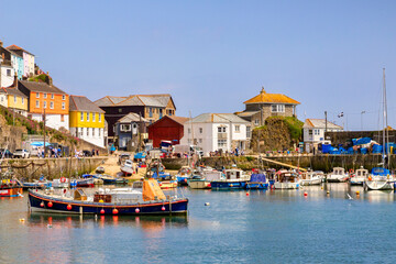 Mevagissey, Cornwall - The harbour and historic buildings on a bright sunny spring day, - obrazy, fototapety, plakaty