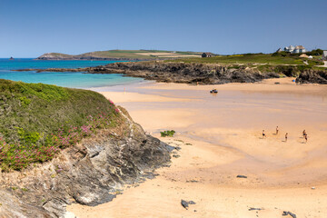 Treyarnon Bay, Newquay, Cornwall, UK - Beautiful sandy bay north of Newquay, young males playing kickabout football.