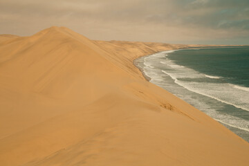 Ocean meets the Sand dunes in Sandwich Harbour Historic, Namibia