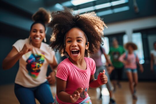 young girl beams with joy during a dance class with her instructor, blurred background