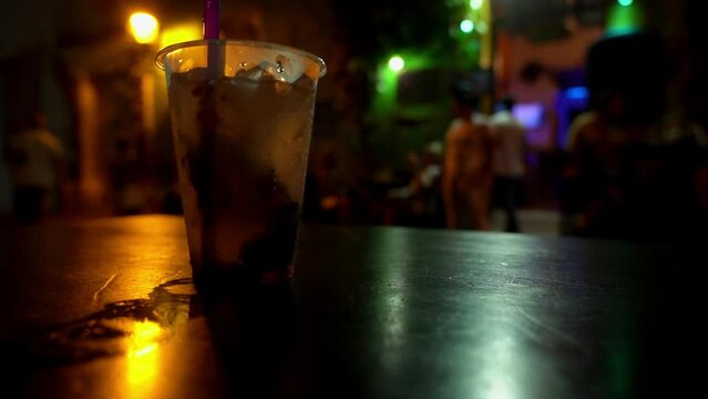 Plastic cup with ice cold Caipirinha Cocktail