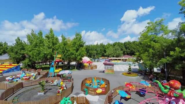 Amusement park for kids at summer sunny day. Aerial view