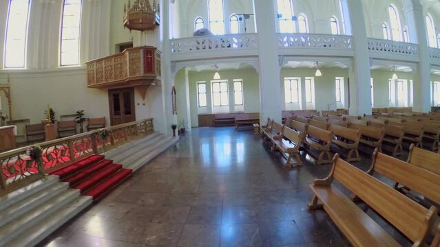 Altar and wooden pews in hall of Evangelical Lutheran Cathedral