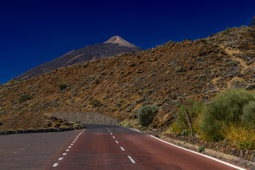 Asphalt road leading to the peak of the El Teide volcano in Tenerife