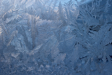 Winter frosty patterns on window glass
