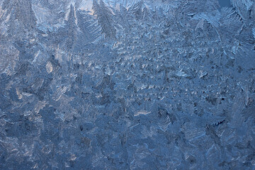 Winter frosty patterns on window glass