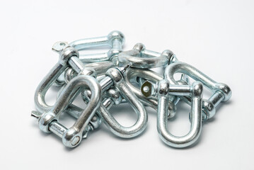 Group of extra-hard D-Rings Shackles to connect towing and lifting elements. White background.