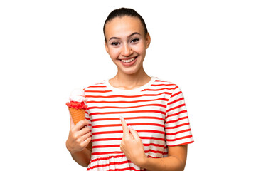 Young Arab woman with a cornet ice cream over isolated background with surprise facial expression