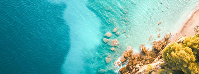 High angle shot of the beach and blue sea