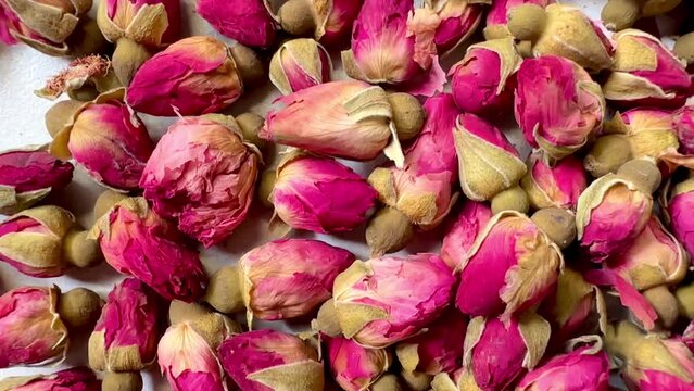 4K The beauty of dried roses on a granite floor.