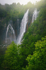 Spectacular high waterfalls in the green forest, Plitvice lakes, Croatia