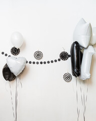 Photozone with balloons and a white background. Birthday decor. Festive decoration. Balloons....