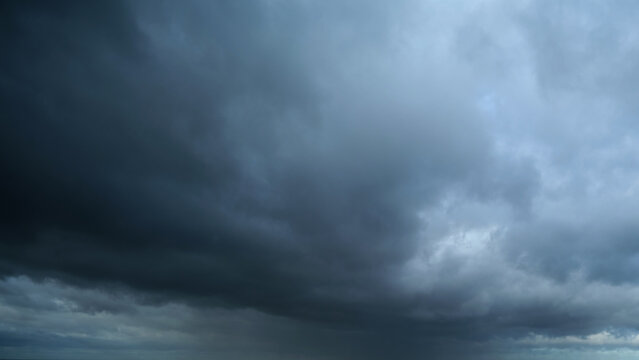 Black stormy sky covered with dark rain clouds