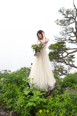 Beautiful bride outdoors in a forest.