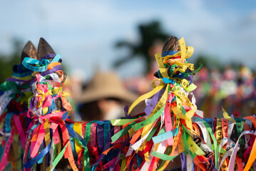 View of the iron gates of the Senhor do Bonfim church covered with colorful souvenir ribbons. City of Salvador, Bahia.