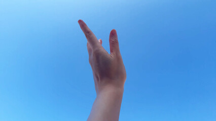 hands hand reaching in clear clean blue sky motion stretching arm symbol success, hope god love happy victory peace spring beautiful sunny day looking at bright light 4k hd