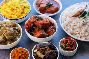Kerala special food sadhya in banana leaf plate with Chicken fry Duck roast Beef fry Fish curry Cabbage thoran. Festival food for Christmas Easter celebration Kerala India Sri Lanka