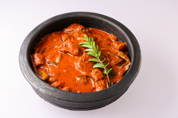 Kerala fish curry coconut milk gravy , cooking spicy Goan fish curry , Indian red fish curry Bengali fish curry in coconut milk Kolkata, India Sri Lanka. Lankan food.
