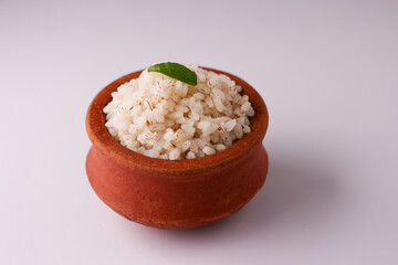 Brown Rice or Kerala boiled rice. Traditional Onam sadhya rice popular with Sambar, Rasam, parippu dal curry ghee Vishu Pongal Diwali festival vegetarian food Kerala Tamil Nadu South India.