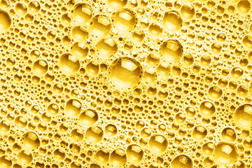 Water foam texture. Color foam structure. Bubble background. Washing suds pattern. Chemical detergent backdrop. Yellow foam. Suds background.