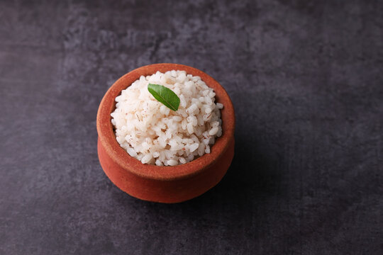 Brown Rice or Kerala boiled rice. Traditional Onam sadhya rice popular with Sambar, Rasam, parippu dal curry ghee Vishu Pongal Diwali festival vegetarian food Kerala Tamil Nadu South India.