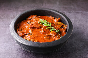 Kerala fish curry coconut milk gravy , cooking spicy Goan fish curry , Indian red fish curry Bengali fish curry in coconut milk Kolkata, India Sri Lanka. Lankan food.