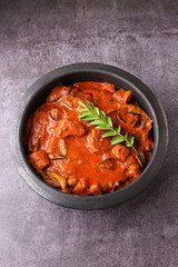 Kerala fish curry coconut milk gravy , cooking spicy Goan fish curry , Indian red fish curry Bengali fish curry in coconut milk Kolkata, India Sri Lanka. Lankan food.