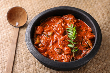 Kerala fish curry coconut milk gravy , cooking spicy Goan fish curry , Indian red fish curry Bengali fish curry in coconut milk Kolkata, India Sri Lanka. Lankan food.