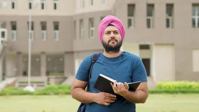 Sikh Indian Student Reading Book and Thinking 