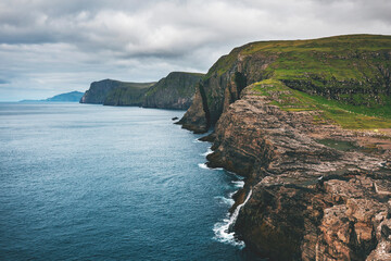 cliffs and meadows by atlantic ocean on a cloudy day