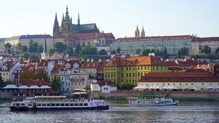 Naklejka na ściany i meble Czech Republic, Prague, September 2023: View from Charles Bridge to Prague Castle, the Vltava River, St. Vitus Cathedral. Concept - tourism, travel.