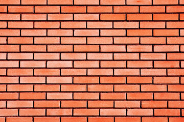 Obraz premium Red brick wall background. Home facade background. Even rectangle blocks pattern. Street design texture. Dark black fugue.