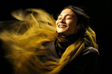 Woman's hair flows in the wind, her golden scarf adding to the dramatic portraiture.