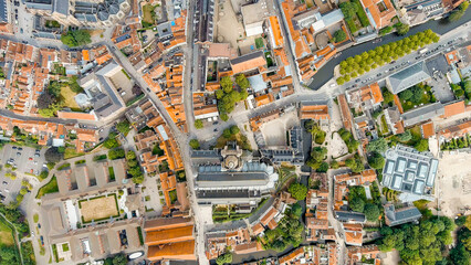 Bruges, Belgium. Cathedral of St. Salvator - 14th-century cathedral with a Gothic tower. Panorama of the city center from the air. Cloudy weather, summer day, Aerial View