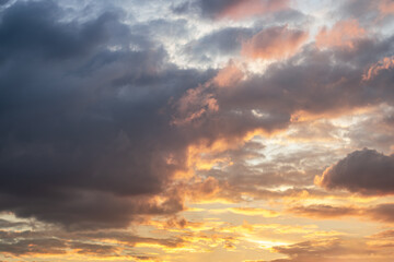 Naklejka na ściany i meble abstract background of cloudy sunset sky golden hour