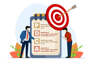 PDCA goal setting concept, acronym with specific, measurable, achievable, relevant and timely, plan realistic goals, arrow pointing right at target with written paper note PDCA improvement goals.