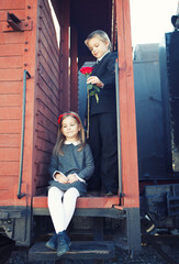 Fototapeta na wymiar little boy and little girl on the train