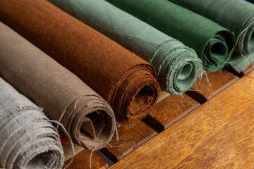 Green and tan linen textile samples