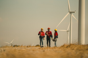 engineer team. renewable energy, power and wind turbine. Electrician or technician man and woman in...