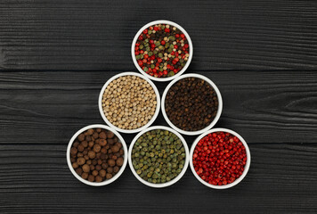 Triangle of assorted peppercorns in bowls