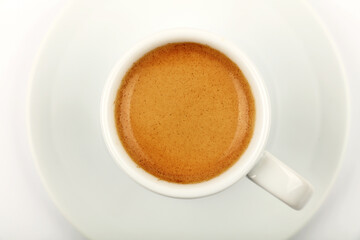Full white espresso coffee cup on saucer isolated