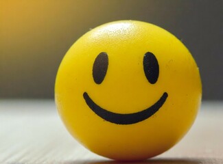 Yellow smiling face ball closeup photography. Happiness concept.